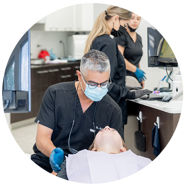 Dr Neil working on a patient