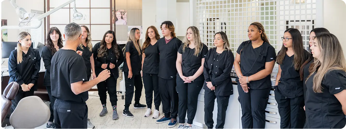 Dr Neil talking with team